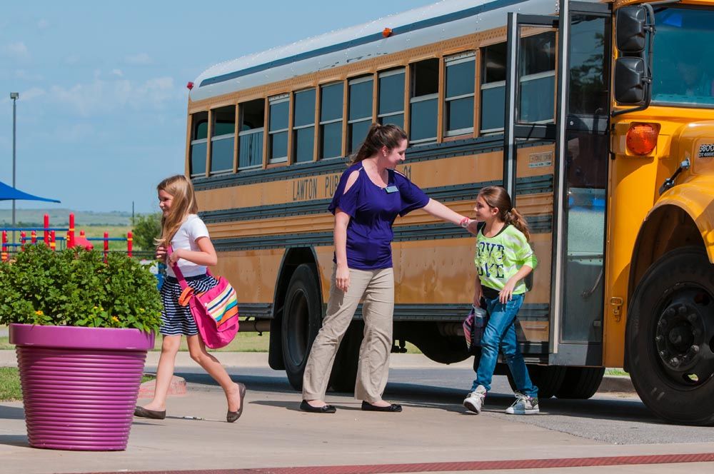 Girl getting off bus